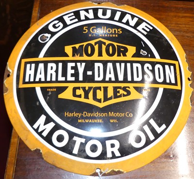 Lot 1128 - A convex enamel advertising sign for Harley...