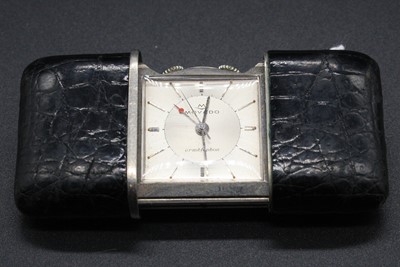 Lot 311 - A Movado Ermetophon purse watch with alarm,...