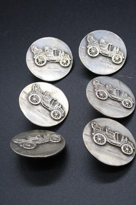 Lot 314 - A set of six silver buttons, each featuring a...