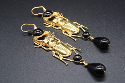 Lot 318 - A pair of gilt metal and black enamel scarab...