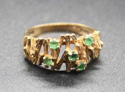 Lot 331 - A mid-20th century 9ct gold and emerald set...