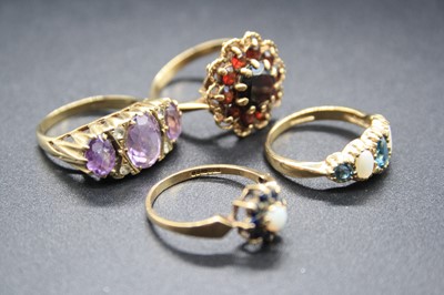 Lot 340 - A modern 9ct gold garnet set flower head...