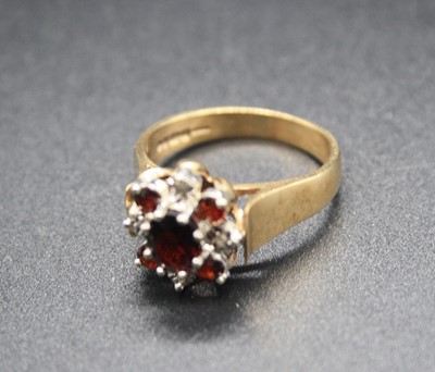 Lot 346 - A modern 9ct gold, ruby and diamond flower...