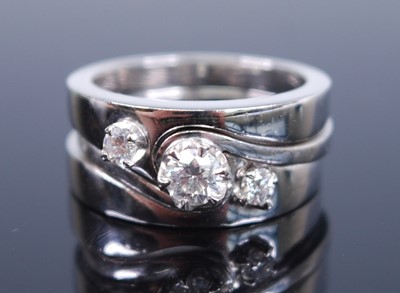 Lot 2384 - Three white metal diamond stacking rings, each...