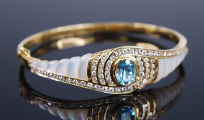 Lot 2192 - A yellow metal blue topaz, diamond and mother...