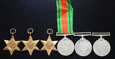 Lot 700 - A group of six WW II medals, to include...