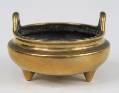 Lot 2541 - A Chinese gilt bronze miniature tripod censer,...