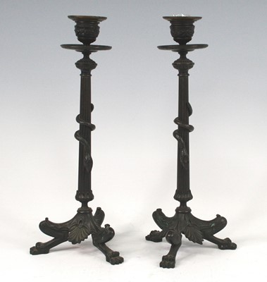 Lot 2519 - A pair of Egyptian Revival bronze candlesticks,...