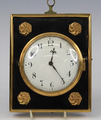 Lot 2652 - An antique wall or bedside clock, having a...