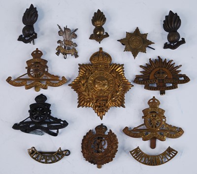 Lot 609 - A small collection of metal insignia, to...