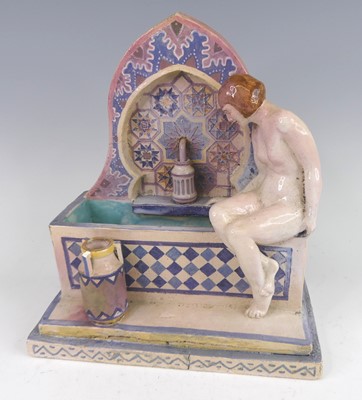 Lot 131 - J.E. Tindall - a circa 1930 ceramic figural...