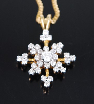 Lot 2336 - An 18ct yellow and white gold diamond star...