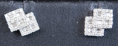 Lot 2324 - A pair of 18ct white gold diamond double...