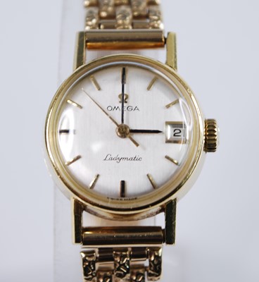 Lot 2425 - An 18ct yellow gold Omega Ladymatic wristwatch,...