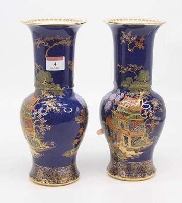 Lot 4 - A pair of Carlton ware blue lustre vases, each...