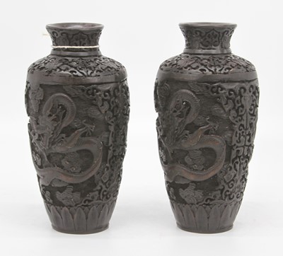 Lot 11 - A pair of Chinese carved resin vases, each...