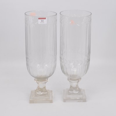 Lot 14 - A pair of cut glass hurricane lamps, the...
