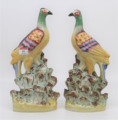 Lot 19 - A pair of Staffordshire pottery models of...