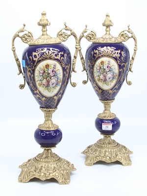 Lot 20 - A pair of reproduction gilt metal mounted urns,...