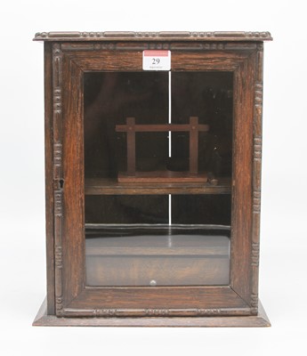 Lot 29 - An early 20th century oak smoker's cabinet,...