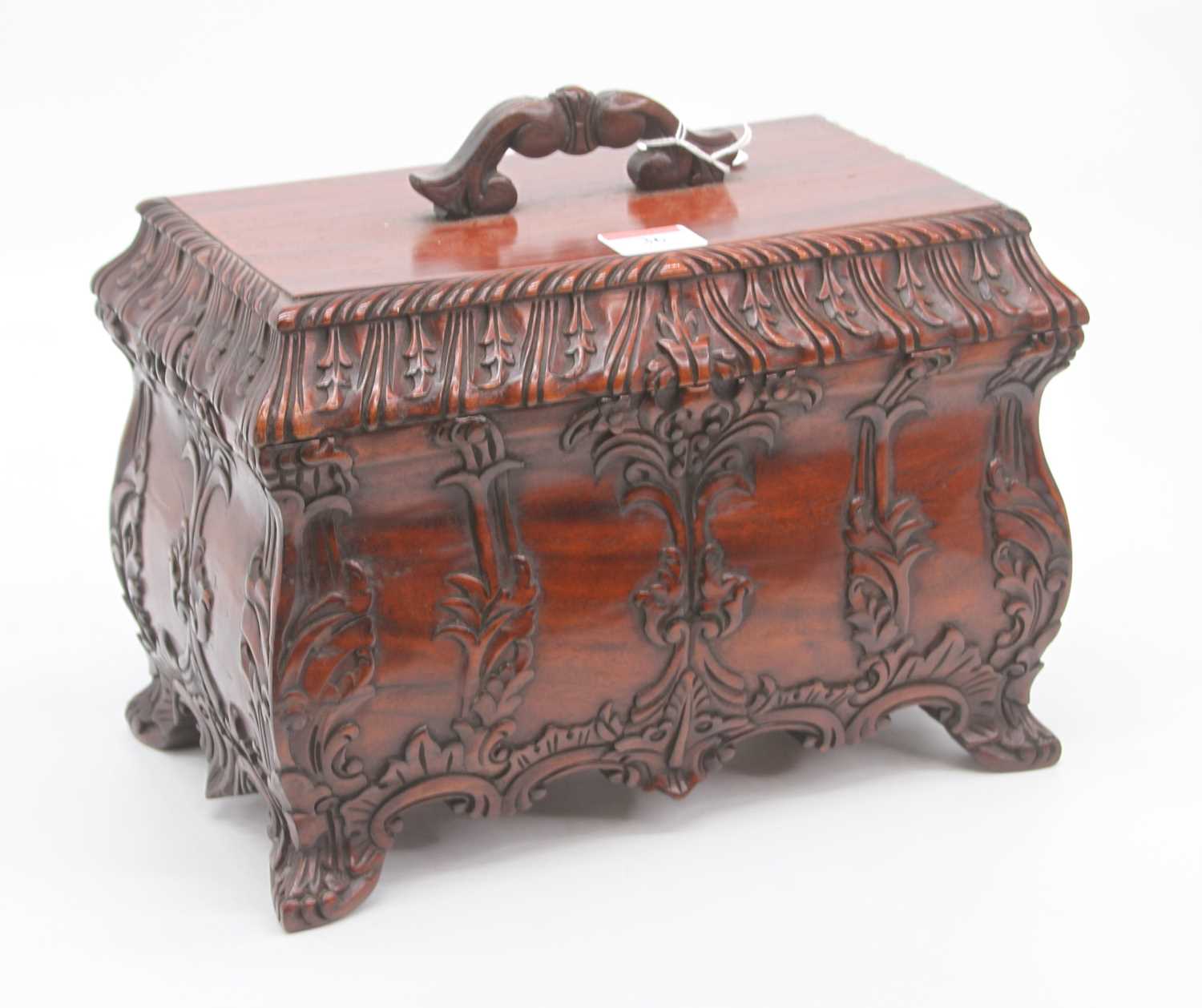 Lot 36 - A modern carved hardwood casket, with fitted...