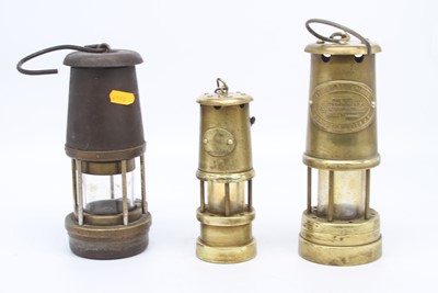 Lot 52 - A brass miner's lamp, bearing a label for The...