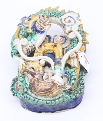 Lot 60 - A Chinese polychrome glazed wall pocket, in...
