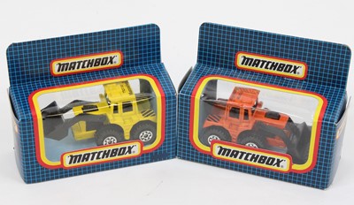 Lot 1379 - Matchbox pair of Muir Hill tractor shovels in...