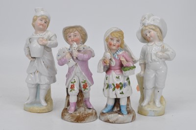 Lot 115 - Four 20th century porcelain figures of...