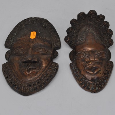 Lot 130 - A pair of African copper masks, largest height...