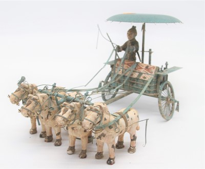 Lot 131 - An eastern verdigris metal model of a cart and...