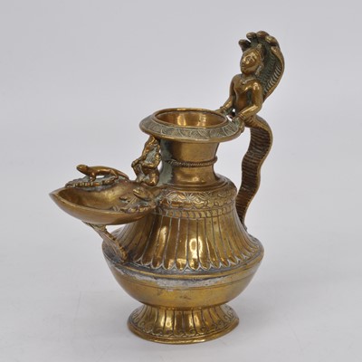 Lot 158 - A Nepalese gilt copper oil lamp, having...