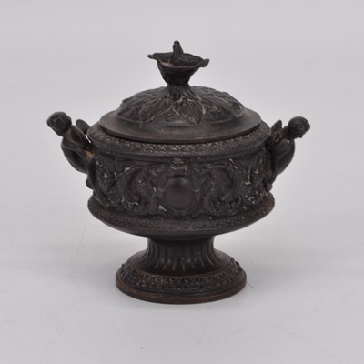 Lot 159 - A 19th century cast iron urn, relief decorated...