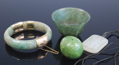 Lot 2551 - A Chinese celadon jade hinge bangle having...