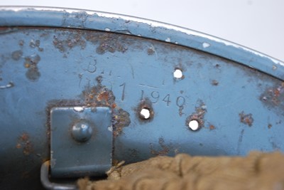Lot 560 - A WW II Zuckerman steel helmet, in grey finish...
