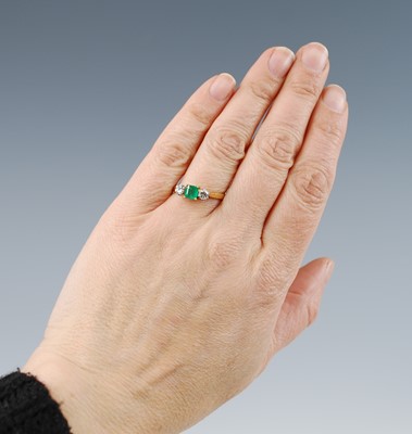 Lot 2508 - An 18ct yellow and white gold emerald and...