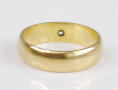 Lot 2510 - An 18ct yellow gold diamond set wedding band...