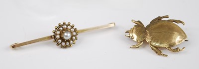 Lot 2513 - Two yellow metal brooches to include a bar...