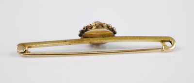 Lot 2513 - Two yellow metal brooches to include a bar...