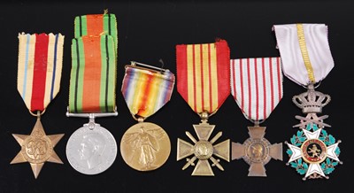 Lot 614 - A collection of six medals, to include WW II...