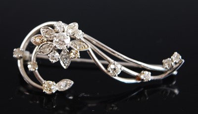 Lot 2553 - An 18ct white gold diamond flower brooch...