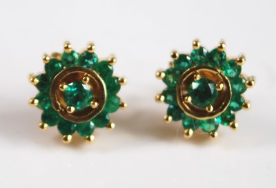 Lot 2556 - A pair of yellow metal emerald circular...