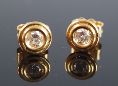 Lot 2557 - A pair of 18ct yellow gold diamond stud...