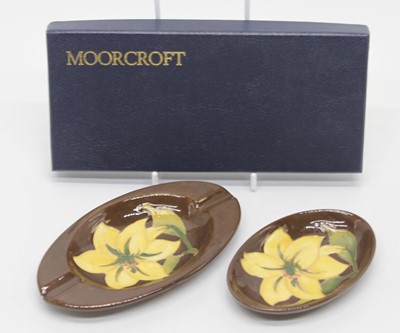 Lot 169 - Two Moorcroft pottery dishes, each tube line...