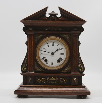 Lot 186 - An early 20th century oak cased mantel clock,...