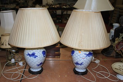 Lot 197 - A pair of Chinese blue & white table lamps,...