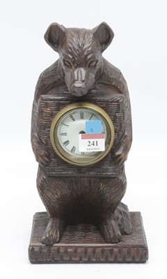 Lot 241 - A Black Forest style mantel clock, carved in...