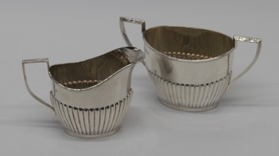 Lot 322 - An Edward VII silver sugar bowl of twin...