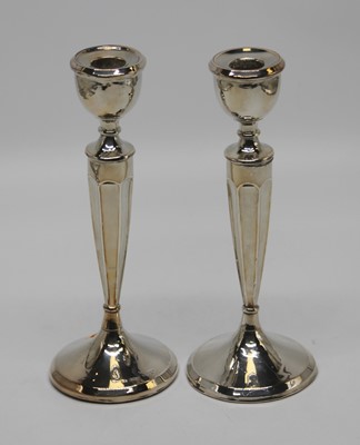 Lot 323 - A pair of George V loaded silver candlesticks,...