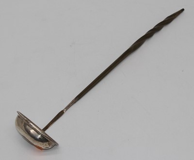 Lot 325 - A George III silver toddy ladle, having a...